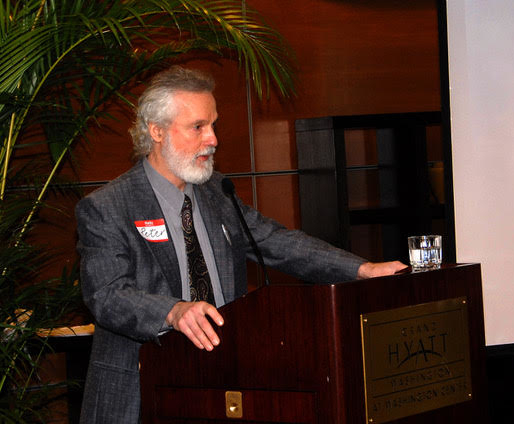 Peter standing at lectern presenting